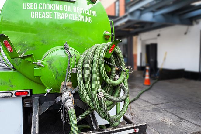 commercial kitchen grease trap being pumped out in Bloomfield